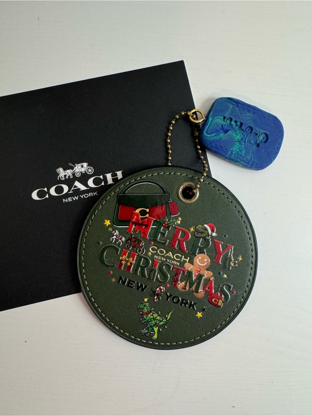 Coach coaster hangtag with Christmas theme and nyc map